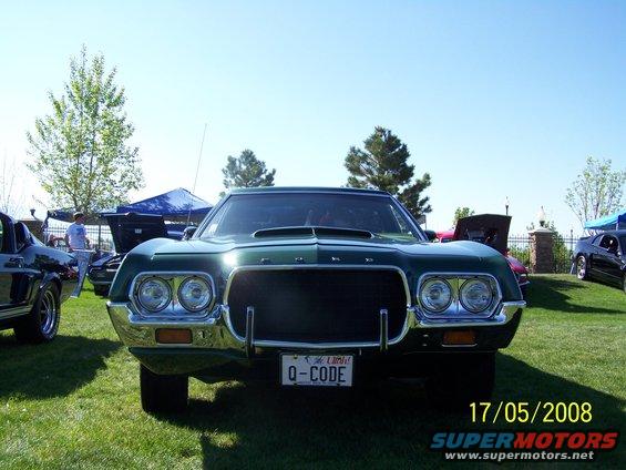 1970 Ford Torino GT front view with Q-CODE license plate. Another car is visible to the left