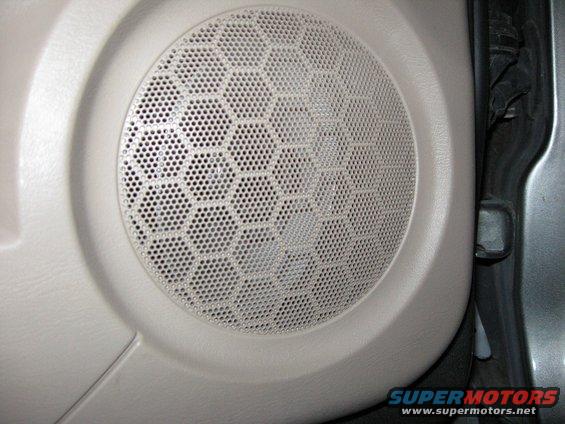 speakercover.jpg The speaker actually sits pretty deep in the door. There has to be a couple inches between the speaker and the grille!