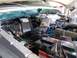 1978 Ford Bronco - The engine bay of a 1978 Ford Bronco shows its internal components and battery.