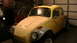 1970 Volkswagen Beetle - A yellow 1970 Volkswagen Beetle is shown from a 3/4 front angle in a garage.