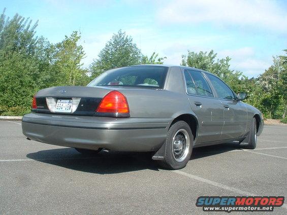Gray 2000 Ford Crown Victoria sedan, rear 3/4 view, parked in lot