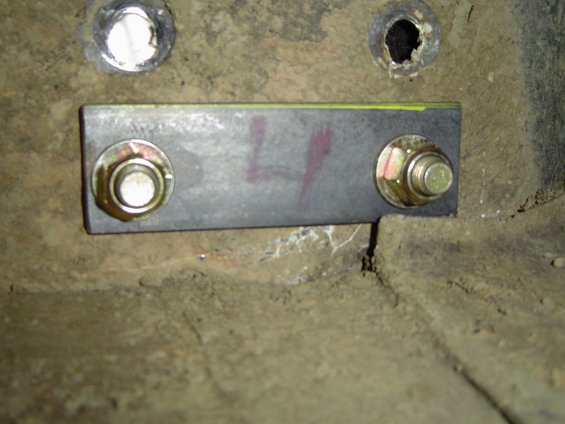 Plate mounted under the body