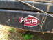 1996 Ford Bronco - A close-up shows a damaged sticker on a dirty vehicle bumper, with text indicating "FullSizeBronco.com".