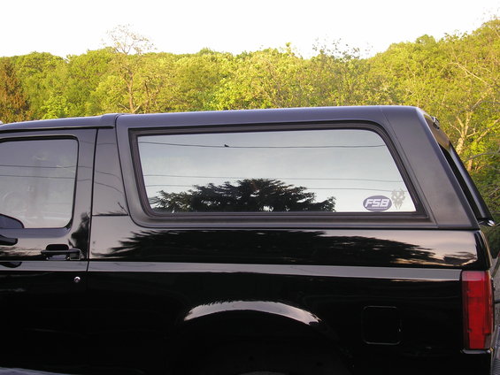 Black SUV side view with FSB sticker on rear window