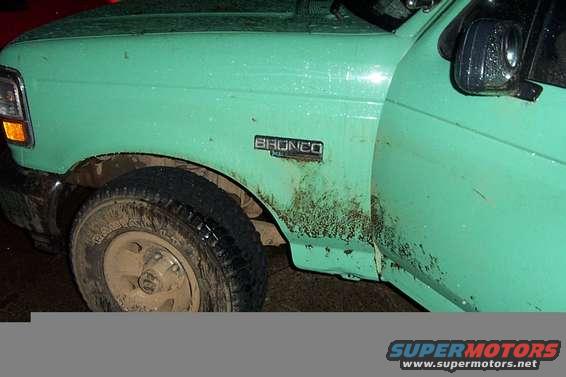 1996 Ford Bronco fender and door, showing the 'BRONCO' badge and muddy side