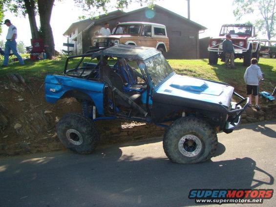 Blue 1994 Ford Bronco modified for off-roading, 3q-front view