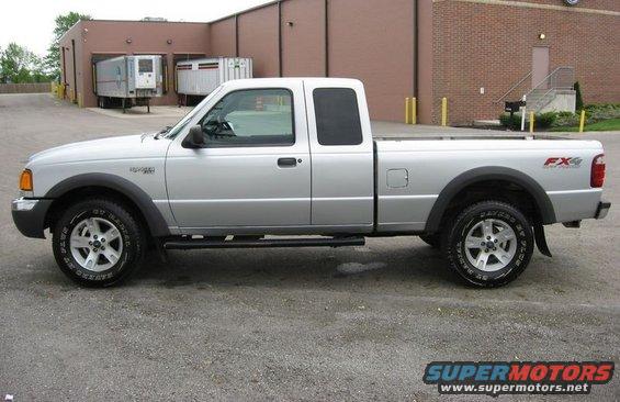 Silver pickup truck with FX4 badging on the rear fender, parked on asphalt