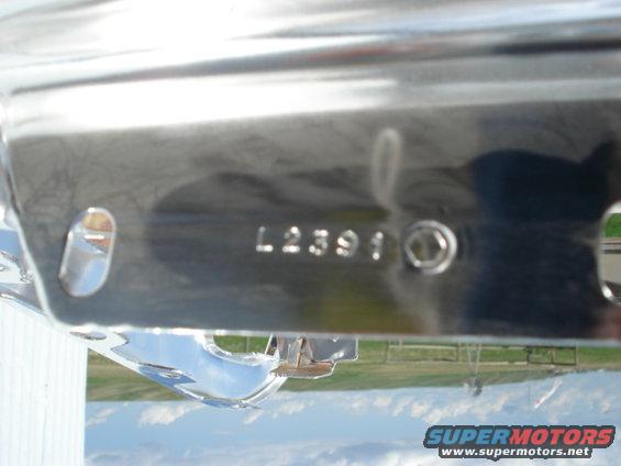 Chrome bumper part with stamped numbers L2391