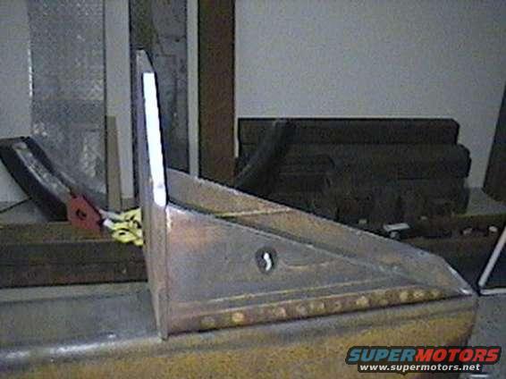 Fabricated metal corner piece with rivets and a keyhole