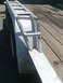1978 Jeep Cherokee - A white metal ramp for a trailer is shown with a wooden deck.