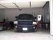 2007 Dodge Durango - Dark blue SUV parked head-on in a garage, showing its front grille and headlights.