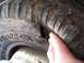 2007 Dodge Durango - A tire has a significant cut in its sidewall, exposing the internal structure.