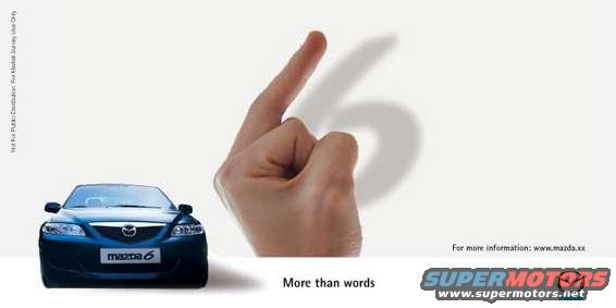 Front view of a blue 2003 Mazda 6 with a hand casting a shadow of the number 6