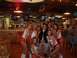 1996 Chevrolet Impala - A group of people pose for a photo inside a Hooters restaurant.