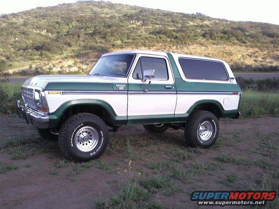 1978 Ford Bronco, white and green, lifted with off-road tires