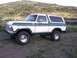 1978 Ford Bronco - This 1978 Ford Bronco is white with green accents and sits on off-road tires.