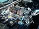 1996 Chevrolet Impala - Close-up view of a modified engine bay chrome components and a custom air intake system.