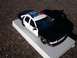 1996 Chevrolet Impala - A model of a 1996 Chevrolet Impala police car is displayed on a white platform.