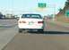 1996 Chevrolet Impala - White Chevrolet Caprice sedan seen from behind on a highway.