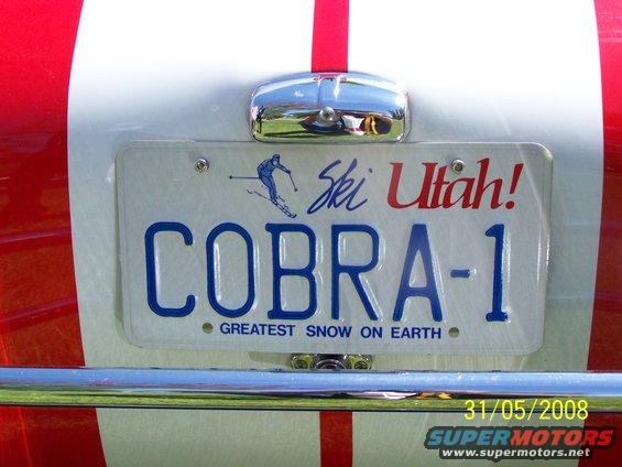 Rear of a car with red and white stripes, Utah license plate COBRA-1, and "Greatest Snow on Earth" slogan
