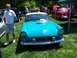 1972 Ford Ranchero - A blue convertible car is parked on grass at an outdoor event.