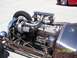 1972 Ford Ranchero - A custom hot rod engine is the focus, with a turbocharger and intricate plumbing visible. Another vehicle is partially seen in the backgrou…