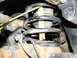 2002 Toyota Sequoia - Close-up view of a vehicle's suspension spring with a measuring tape for scale.