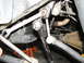 2002 Toyota Sequoia - Tools are used to work on suspension components. The SuperMotors.net logo is visible in the lower right corner.