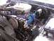 1978 Ford Bronco - Close-up view of the engine bay in a 1978 Ford Bronco, showing the engine components and wiring.