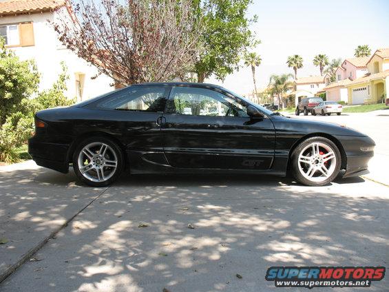 Black 1995 Ford Probe GT parked on driveway, side view