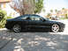 1995 Ford Probe - Side profile of a black 1995 Ford Probe GT with silver alloy wheels.