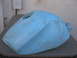 2005 Yamaha R1 - A light blue motorcycle fuel tank sits on a table, showing signs of wear and tear.