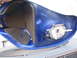 2005 Yamaha R1 - Close-up view of the interior of a blue motorcycle fuel tank, showing foam padding and the fuel pump assembly.