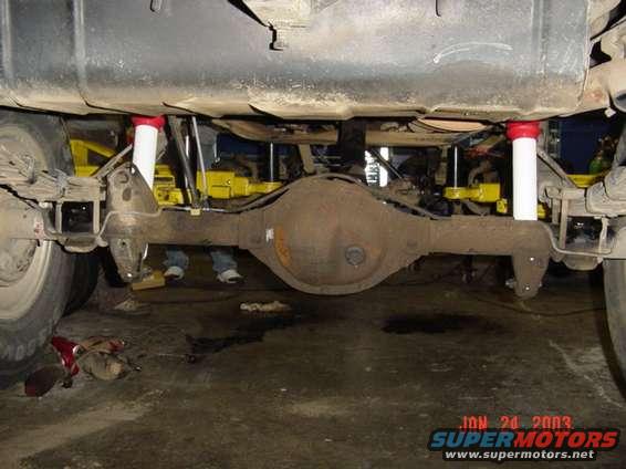 Longer shocks, springs over the axle 