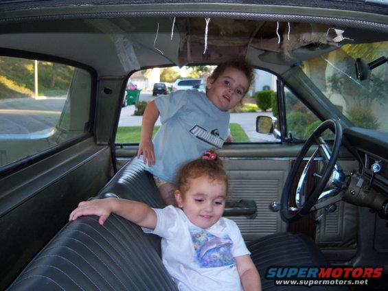 Interior of a 1967 Ford Ranchero with two children inside
