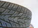 1996 Ford Probe - A close-up of a tire tread shows a puncture mark.