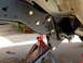 1996 Ford Bronco - The vehicle's frame and suspension parts are visible, supported by jack stands during maintenance.