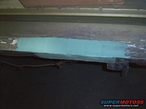 bent rear cross member under tail gate... pulled it out best i could but it used alot of filler