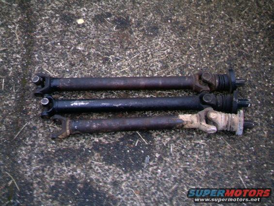 front-driveshafts-002.jpg Three front driveshafts The shortest is a shortened shaft for a D-35 conversion on a FM145 transmission application
the middle one is a stock length FM145 shaft, and perfect in length for a D-35 FM146 set up
The long one is a stock length FM146 shaft