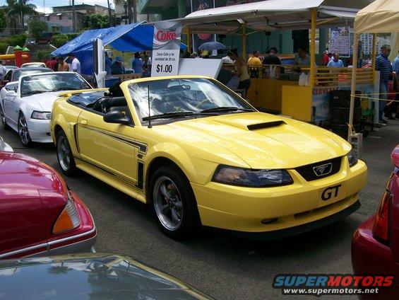 Yellow 2001 Ford Mustang GT convertible front 3/4 view