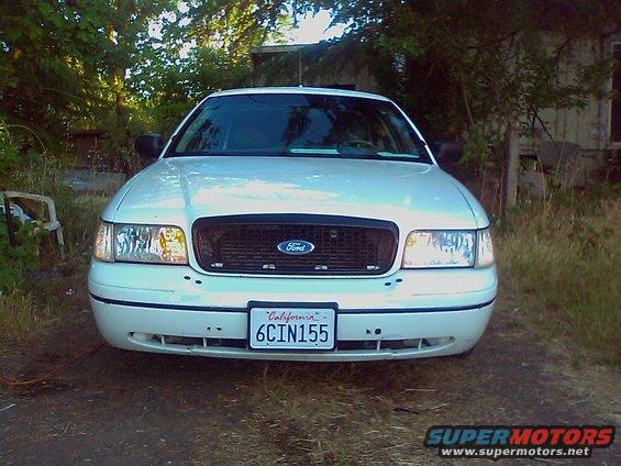 White 2000 Ford Crown Victoria front view parked outside