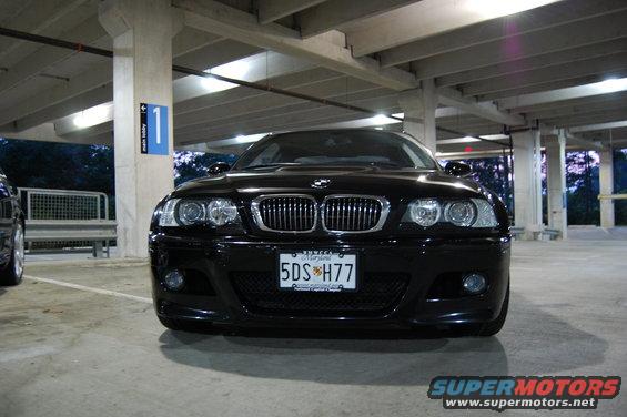 Black 2002 BMW M3 front view in parking garage