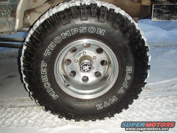 Mickey Thompson Baja MTZ tire on a chrome wheel, covered in snow