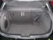 2003 Ford Focus - The cargo area of a 2003 Ford Focus features a net and side storage compartment.