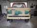 1996 Ford Bronco - Rear view of a 1996 Ford Bronco undergoing body repair and painting in a workshop.
