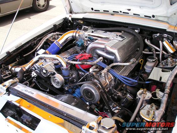 Engine bay with chrome intake manifold, polished valve covers, and Griffin radiator