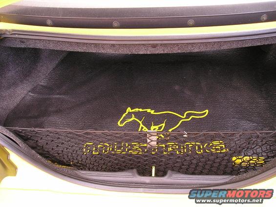 Trunk interior with yellow Mustang horse logo and "MUSTANG" text