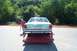 1991 Mercury Marquis - Rear view of a 1991 Mercury Marquis being loaded onto a trailer, with a man standing nearby.