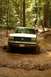 1987 Ford Bronco - This 1987 Ford Bronco navigates a challenging muddy off-road path.