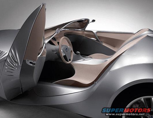 Concept car interior with open door, showing seats and steering wheel with BMW logo